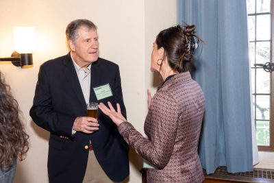 Alumni and student chatting