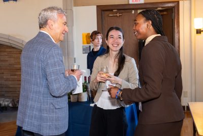 Alumni and students chatting