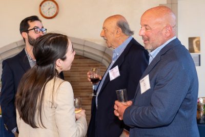 Alumni and student chatting