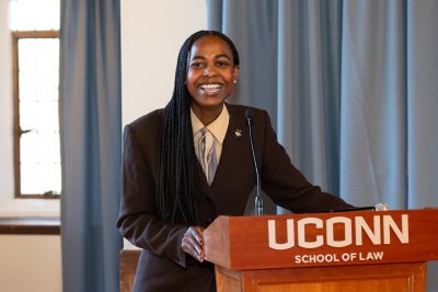 Student smiling at podium