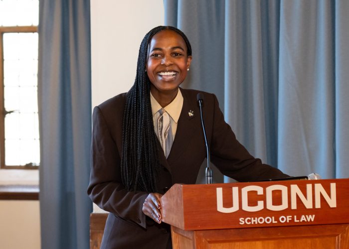Student smiling at podium
