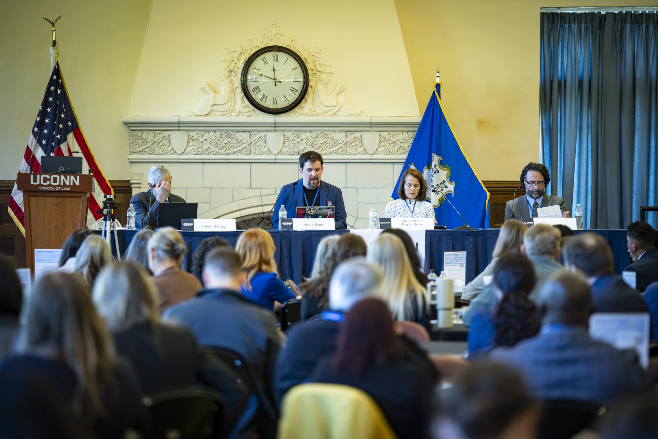 People at a conference looking at a speaker